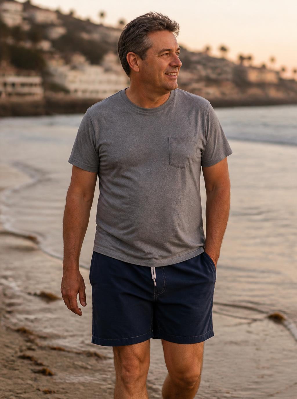 A man walking the beach at golden hour
